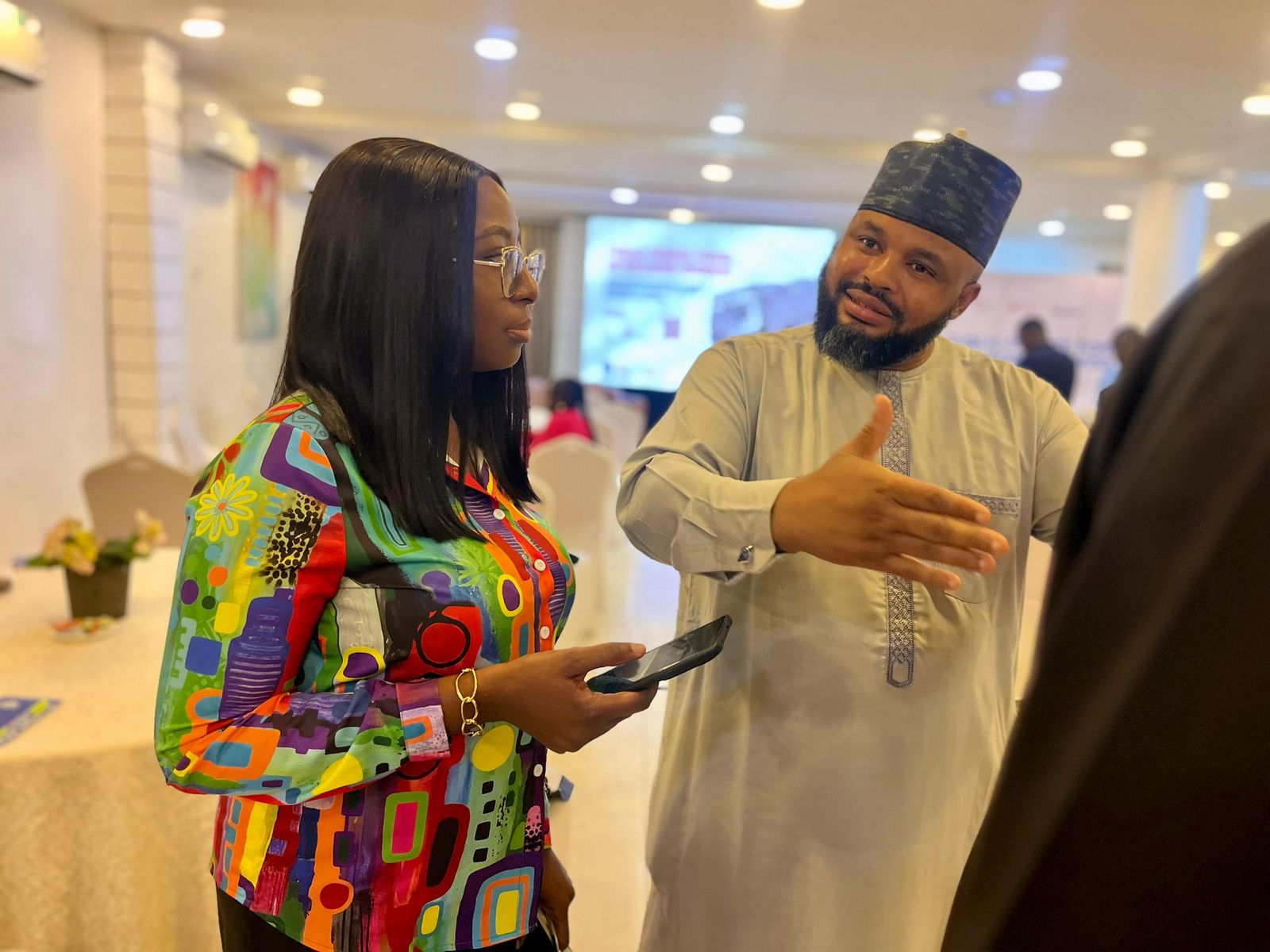 Keselash Agricom in conversation with a partner at an agriculture event